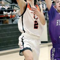 John Sandoval jumps past a Hydro-Eakly defender to shoot a layup