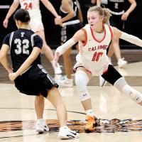 Lila Winegeart forces an opponent to dribble in a different direction