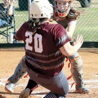 Brenlee Voss turns to tag a Verden runner at home plate