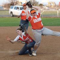 Mikah Mayo watches the ball hit the ground after she collides with Cierra McBroom