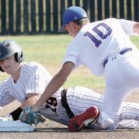 Kaleb Thiessen slides into second, knocking out the ball