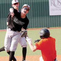 Kingston Arnold steps off the bag to avoid a Putnam City base runner