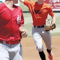 Kyler Thiessen tries to run down a base runner after a pickoff play