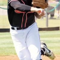 Wyatt Cox makes a throw to first base