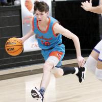 Hunter Arnold dribbles the ball past a defender