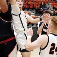 Brendon Voss reaches up in traffic to grab for a rebound