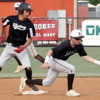 Kingston Arnold stretches out to knock down a wide throw to second base