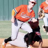 Kyler Thiessen looks a pickoff throw to second base into his glove