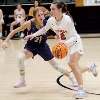 Allie Harris dribbles the ball up the court 