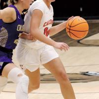 Mattie Pritchett dribbles the ball past an Okarche defender