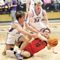 Wyatt Cox throws the ball to a teammate after diving for a loose ball