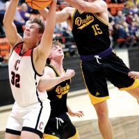 P.K. Harris tries to grab a rebound away from James Daughety