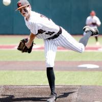 Hunter Arnold watches a pitch fly toward the plate