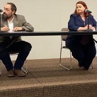 Aaron Hines and Amy Neathery listen to a question