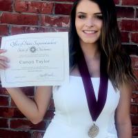 Okarche’s Carsyn Taylor holds up her certificate