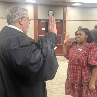 Aaliyah Ezeh is sworn in by Judge Bob Hughey as a new CASA volunteer