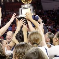 Matt Goucher smiles as he watches players accept the program’s first-ever gold ball