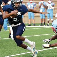 Dorian Plumley eluding a Lawton Eisenhower defender