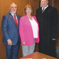 Paul Hesse, right, stands beside Tom Manske and Tracey Rider