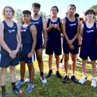 Members of EHS boys cross country team with head coach Jennifer Myers