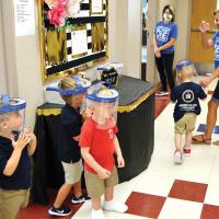 Tana Ramsey leads her Sacred Heart preschool students