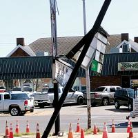 Damaged sign pole