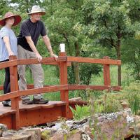 Daniel and Ruthie Pugh survey the gardens from the bridge