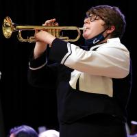 David McBee plays taps to end the ceremony