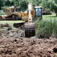Workers dig up the ground on the south end of Legion Park