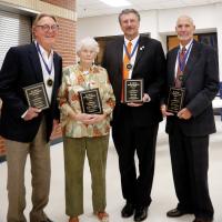 From left, Larry Bross, Virginia Witt (for father, Ralph Higgins), Tim Gatz and Ancel Airington