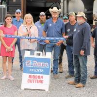Tracey Rider (holding the oversized scissors) is joined by District 3 foreman Dean Walker and other district personnel 
