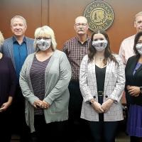 Domestic Violence Awareness Month proclamation with commissioners and advocates