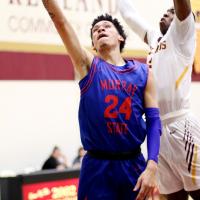 Dyson Plumley shoots a layup