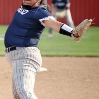 Micah Woods winds up to throw a pitch