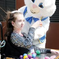 Landry Lewis shows the Easter bunny one of the eggs she collected