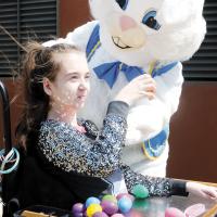Landry Lewis shows the Easter bunny one of her eggs 