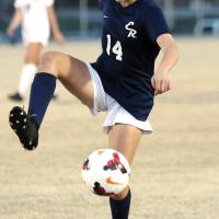 EHS girls soccer_Conner jumps into the air