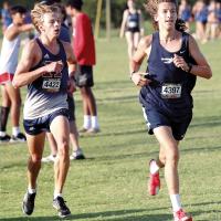 Ethan Brooks runs past a Regent Prep runner