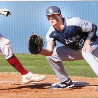 Kolton Hunt eyes a pickoff throw to first base