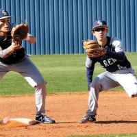 Vincent Walker and Ty Vincent both converge on the bag for a pickoff throw