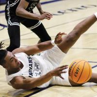 EHS boys basketball_Moore tries to make pass after diving
