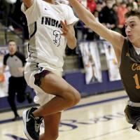 Deonte Washington peers past the arm of a Piedmont player’s block attempt