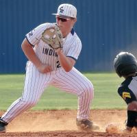 Garrett March eyes a pickoff throw to the bag