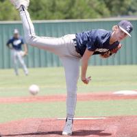 Gavin Tinsley watches a pitch fly toward the plate
