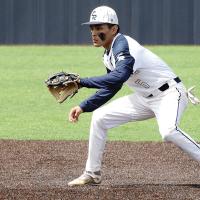 Vincent Walker eyes a pickoff throw to second base