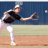 Blake Bailey steps near a runner to snag a pickoff throw