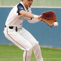 Mason Fulton steps outside the baseline to snag a grounder in foul territory