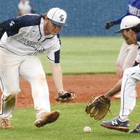 Palmer Ellis, left, and Ryan Island try to field a Guthrie bunt