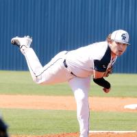 Palmer Ellis watches a pitch sail toward the plate