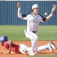 Blake Bailey has the baseball bounce off his glove